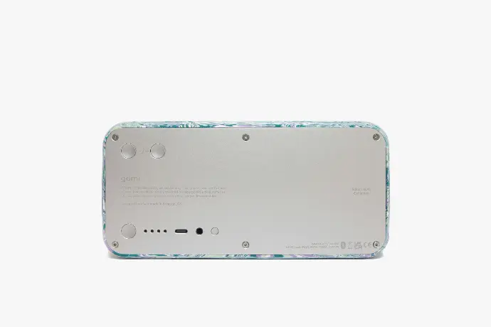 a close up of a cell phone on a white surface